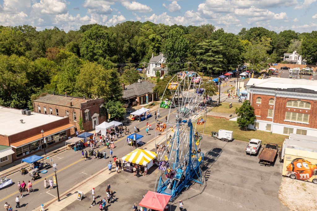 Summerfest in York, South Carolina: Music, Food, and Family Fun Aerial view of York Summerfest showing a Ferris wheel, vendor tents, and crowds in historic downtown York, SC.