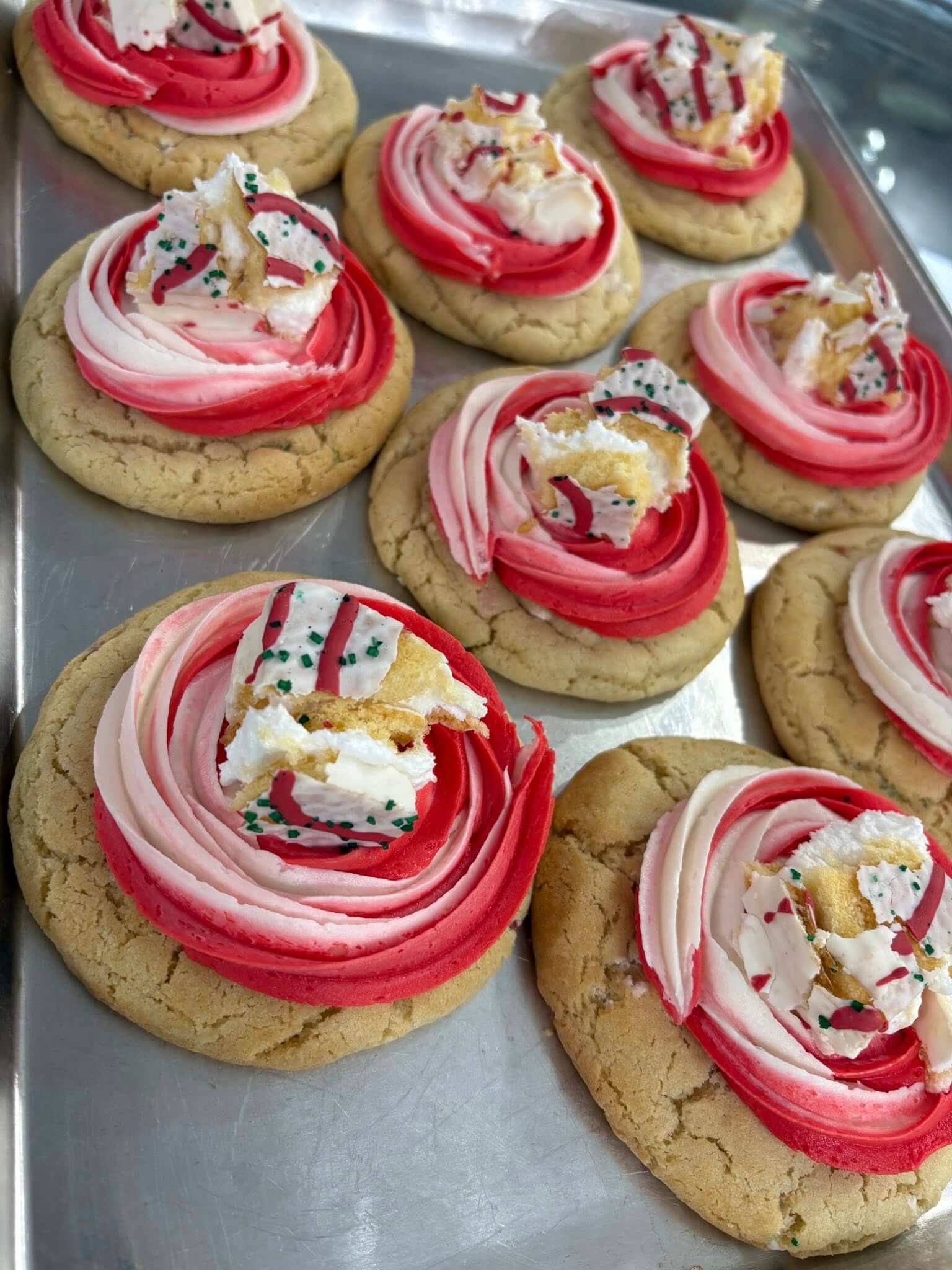 Must Try Sweet Treats in The Olde English District Little Debbie Christmas Tree Cookies decorated with green icing and red sprinkles.