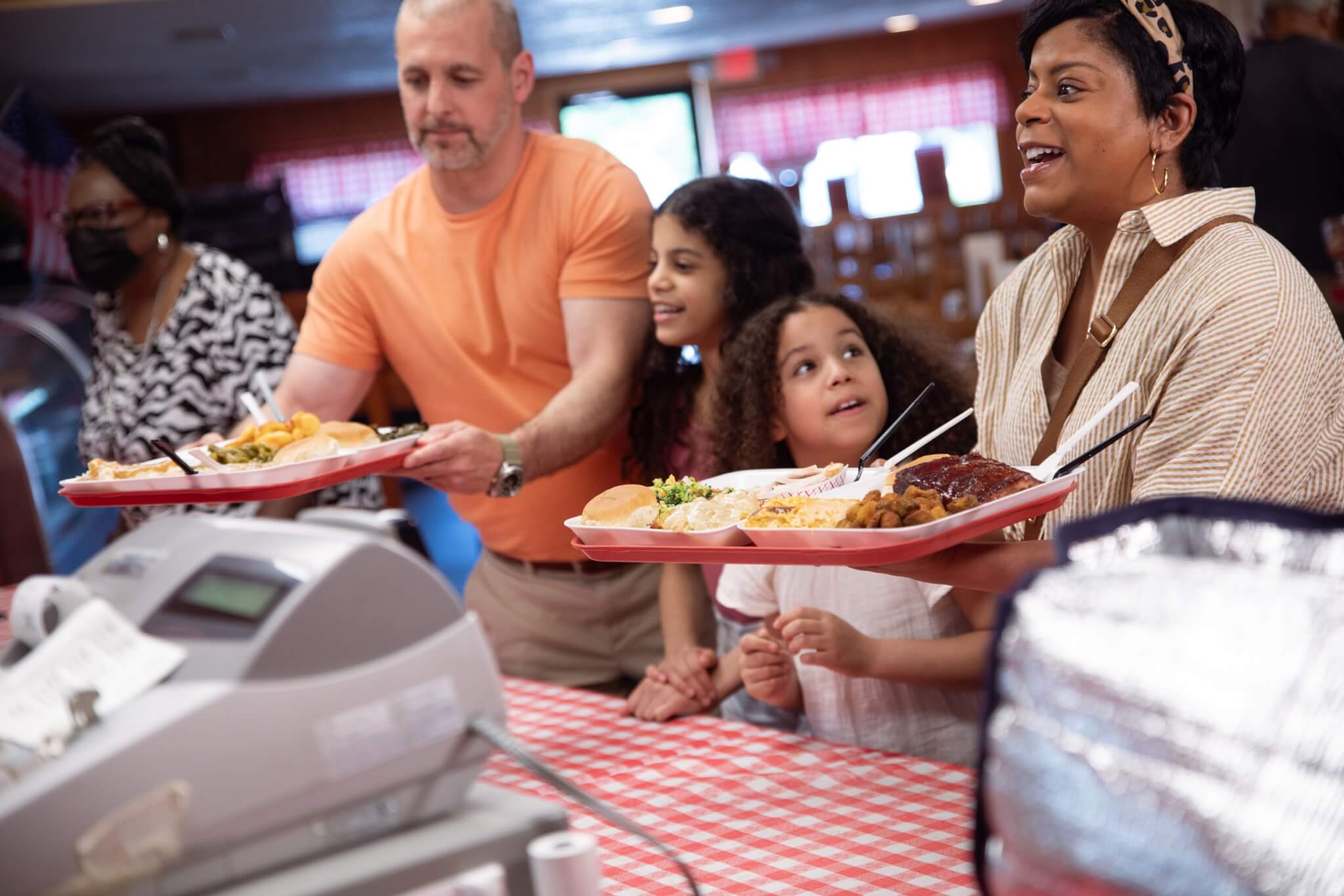 5 Things To Do In Union County photo of family ordering food at Midway BBQ in Union County