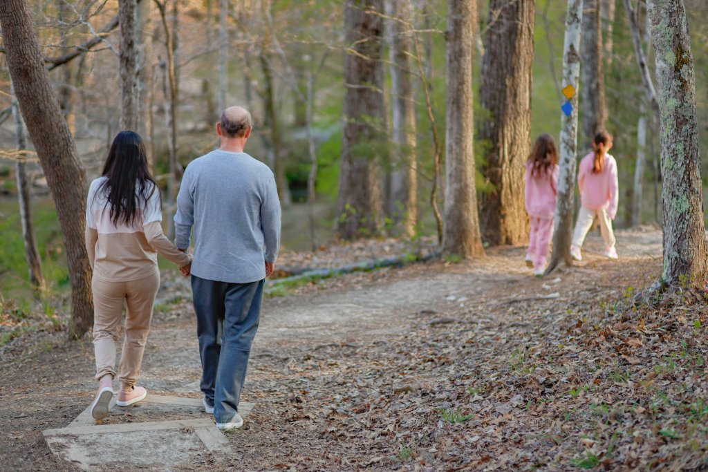 family walking a trail at kings mountain state park