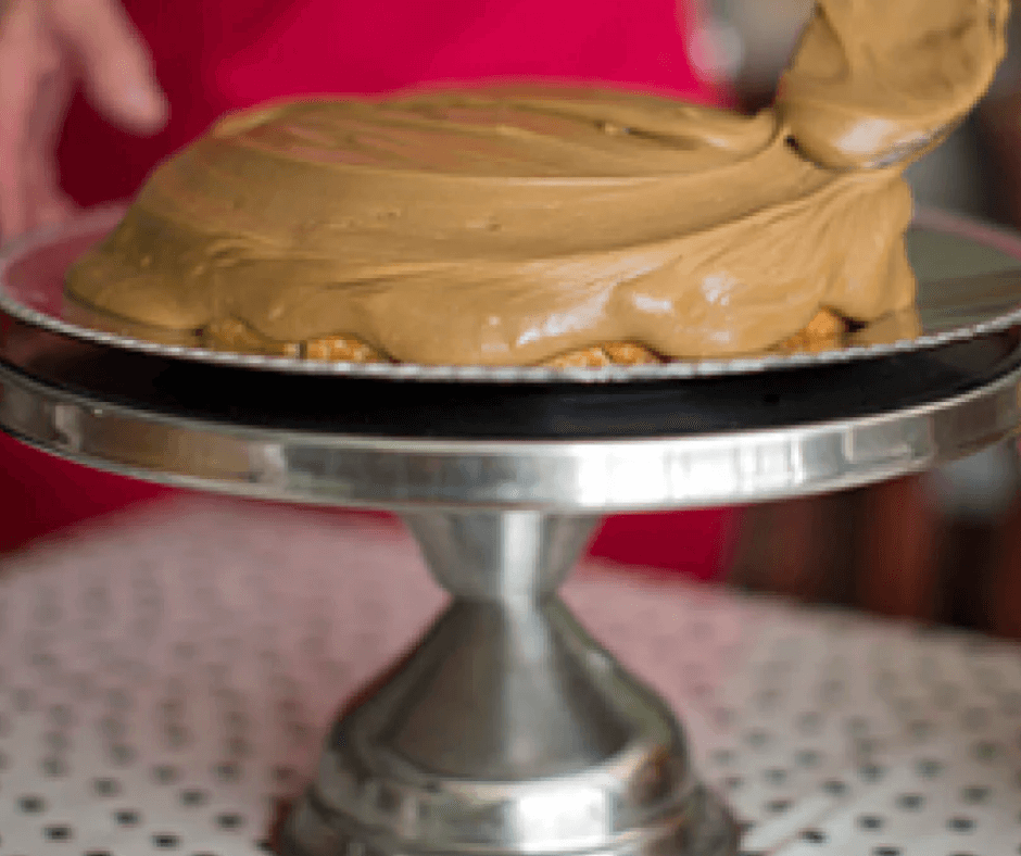 Must Try Sweet Treats in The Olde English District A caramel cake displayed on a serving platter.