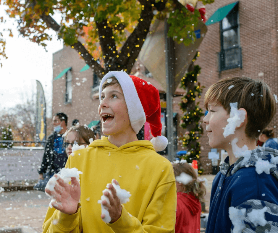 Two boys playing in snow
